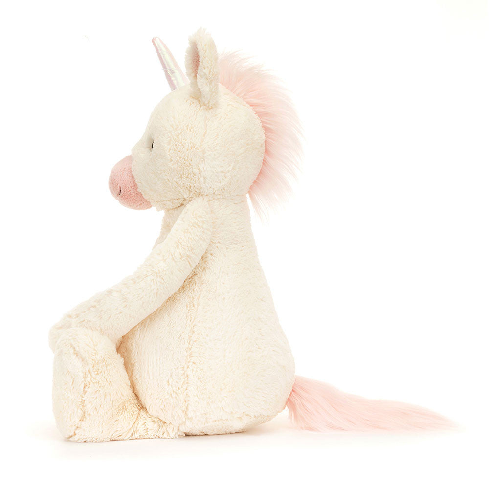 Riesiges flauschiges Jellycat Bashful Unicorn in Weiß mit rosa Schnauze und glänzendem Einhorn, Seitansicht