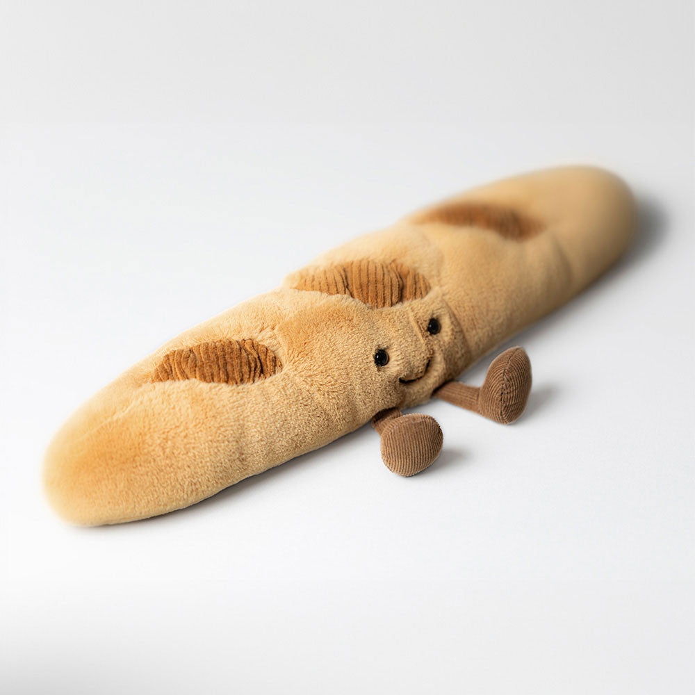 Jellycat Baguette Kuscheltier liegend, 34 cm langes weiches Plüsch-Baguette mit brauner Kruste und freundlichem Gesicht