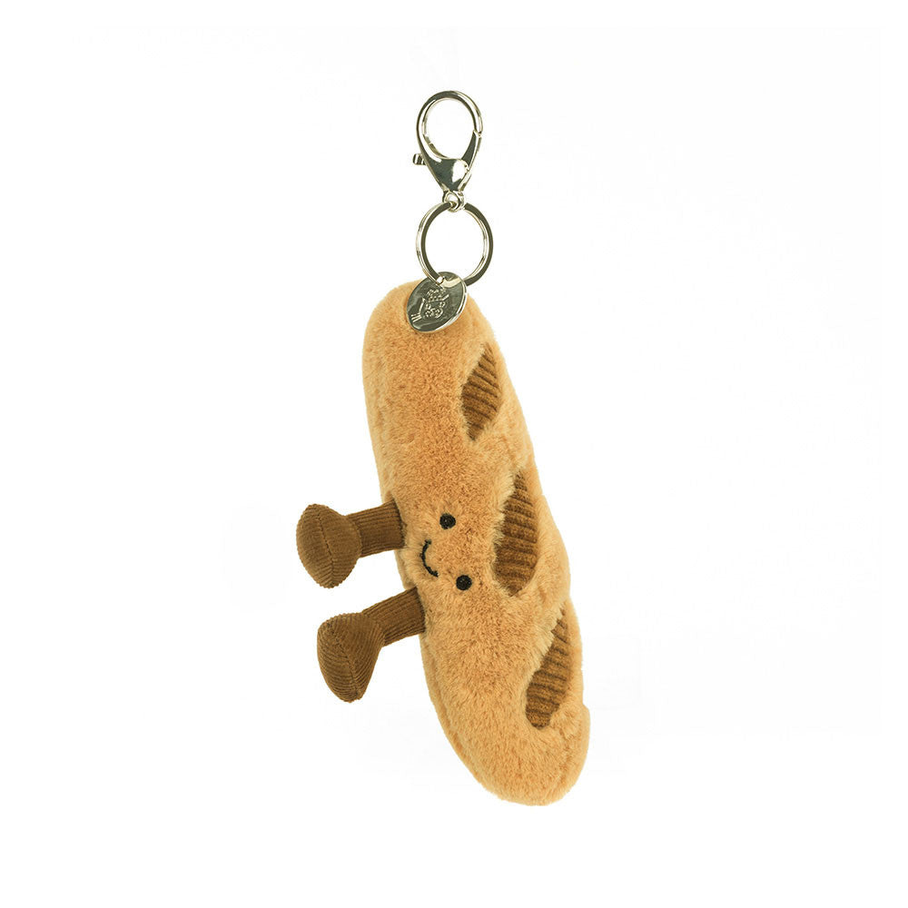 Jellycat Baguette Schlüsselanhänger am Metallkarabiner mit silbernem Jellycat-Logo, lächelndes Baguette-Kuscheltier, Frontansicht
