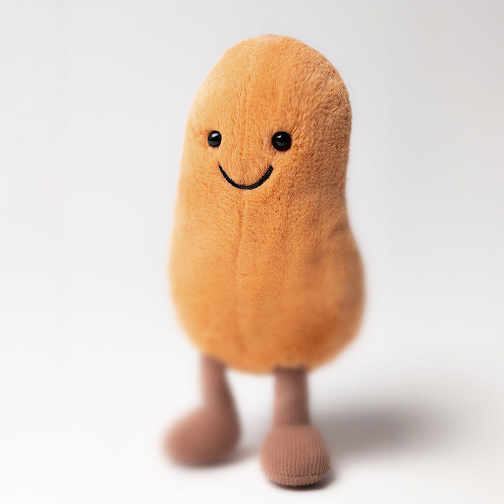 Kuschelige Bohne von Jellycat mit freundlichem Gesicht aus orangenem Plüsch und Cord-Beinchen, Frontansicht