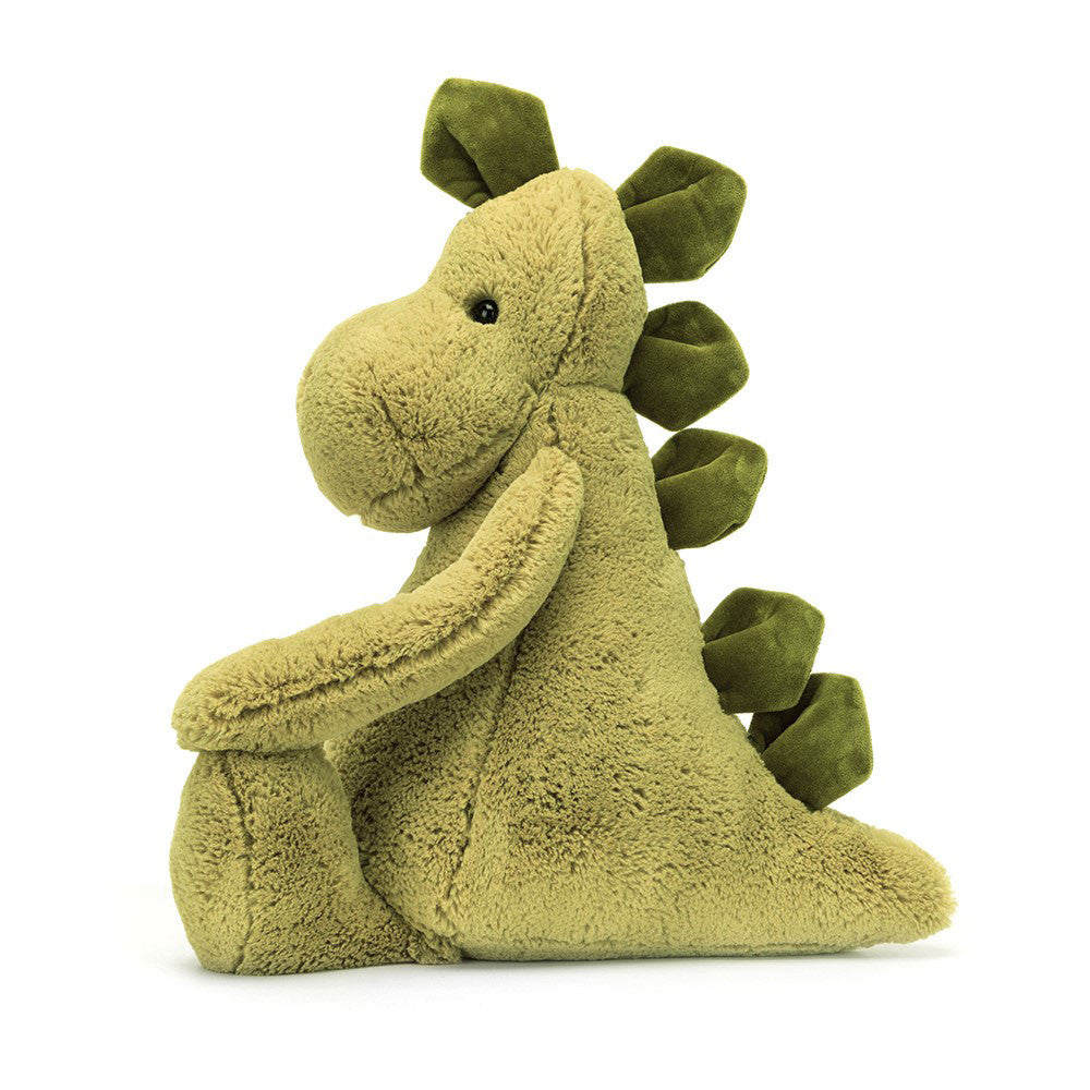 Grüner Jellycat Bashful Dino mit freundlichem Gesicht und dunkelgrünem Rückenkamm, Seitansicht