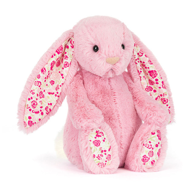 Flauschiger Blushkin Luxe Bunny mit Blütenohren und Füßen in Pink, weich, schräge Vorderansicht